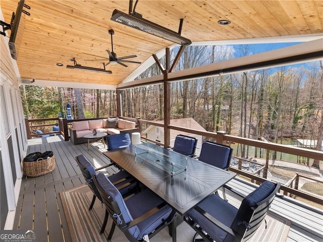 6041 Blackberry Ln, Buford, GA 30518 - deck featuring a ceiling fan and view of wooded area