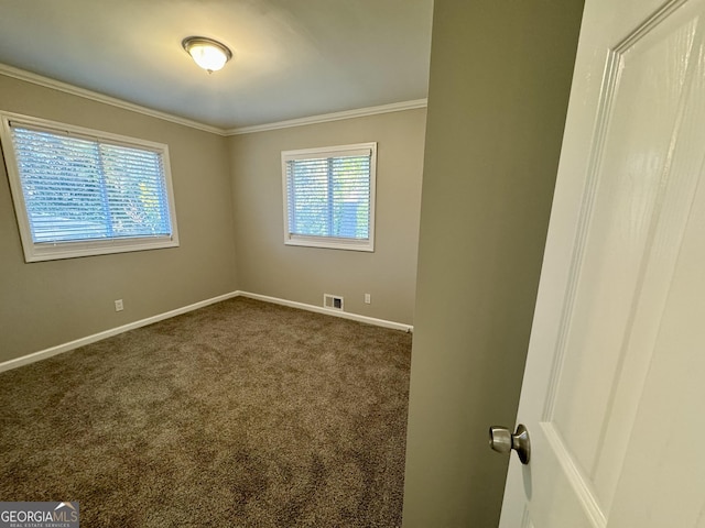 1380 Margarette Dr, Decatur, GA 30035 - unfurnished room featuring visible vents, baseboards, dark carpet, and crown molding