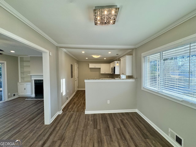 1380 Margarette Dr, Decatur, GA 30035 - kitchen featuring visible vents, white cabinets, dark wood-type flooring, and ornamental molding