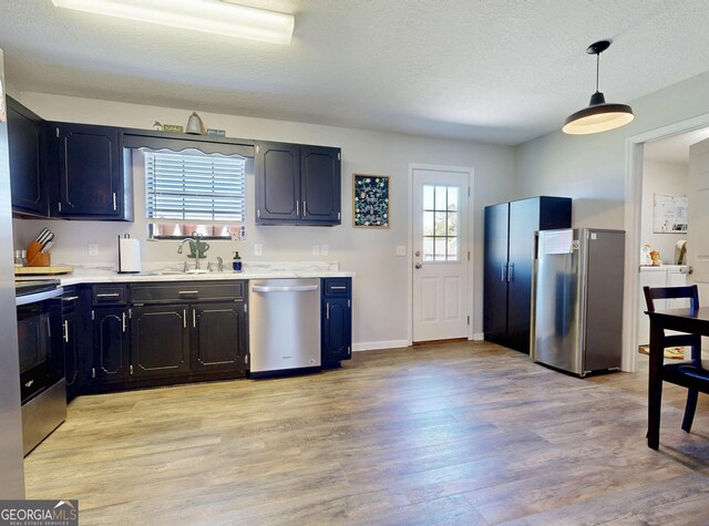 5612 Hickory Dr, Patterson, GA 31557 - kitchen with a sink, light countertops, light wood-type flooring, and stainless steel appliances