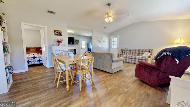 5612 Hickory Dr, Patterson, GA 31557 - dining room with a ceiling fan, baseboards, visible vents, vaulted ceiling, and light wood-style floors
