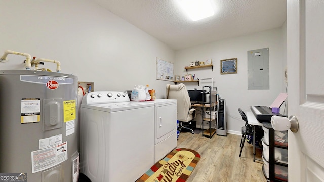 5612 Hickory Dr, Patterson, GA 31557 - laundry room with electric panel, water heater, light wood-style floors, separate washer and dryer, and laundry area