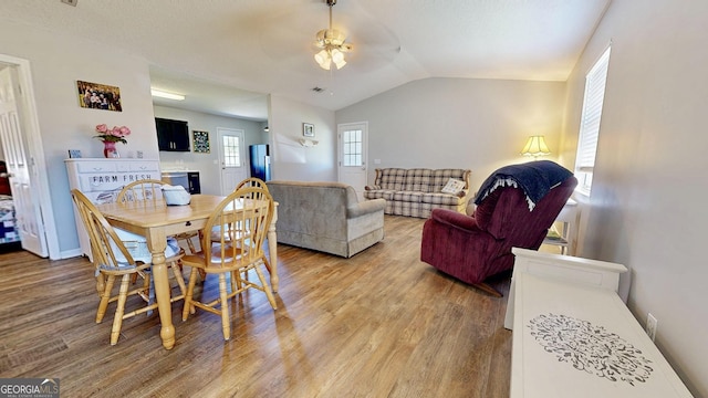 5612 Hickory Dr, Patterson, GA 31557 - dining room with light wood-style flooring, baseboards, a ceiling fan, and vaulted ceiling