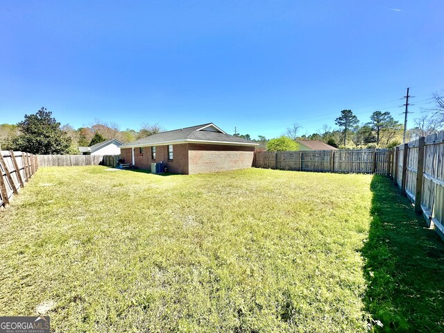 5612 Hickory Dr, Patterson, GA 31557 - view of yard with central AC unit and a fenced backyard