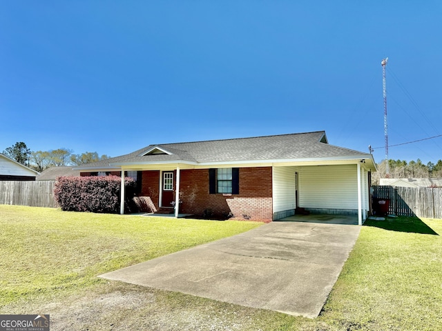5612 Hickory Dr, Patterson, GA 31557 - single story home with a carport, concrete driveway, fence, and a front lawn