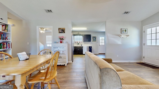 5612 Hickory Dr, Patterson, GA 31557 - dining area featuring visible vents, a ceiling fan, baseboards, and wood finished floors