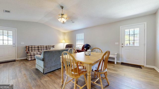 5612 Hickory Dr, Patterson, GA 31557 - dining area featuring lofted ceiling, plenty of natural light, wood finished floors, and visible vents