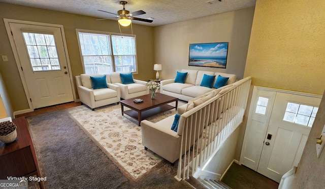 2172 Nancy Way, Loganville, GA 30052 - living room featuring wood finished floors, a ceiling fan, visible vents, and a textured ceiling