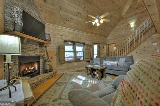 65 Weoka Ct, Ellijay, GA 30540 - living area featuring wood finished floors, wood walls, high vaulted ceiling, wooden ceiling, and a ceiling fan