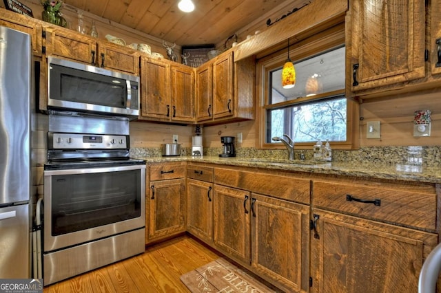 65 Weoka Ct, Ellijay, GA 30540 - kitchen with stainless steel appliances, a sink, light wood-style flooring, brown cabinetry, and wooden ceiling