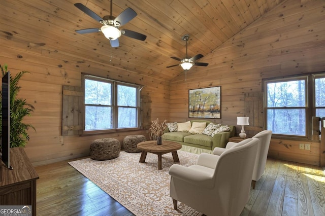 65 Weoka Ct, Ellijay, GA 30540 - living area with vaulted ceiling, healthy amount of natural light, hardwood / wood-style flooring, a ceiling fan, and wooden walls