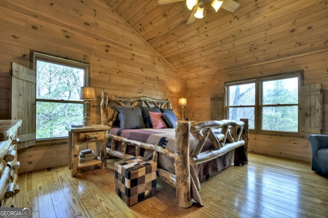 65 Weoka Ct, Ellijay, GA 30540 - bedroom featuring vaulted ceiling, multiple windows, wooden walls, wood-type flooring, and wood ceiling