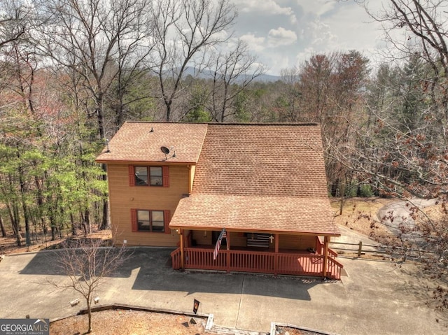 65 Weoka Ct, Ellijay, GA 30540 - a-frame home with a shingled roof, fence, and a view of trees