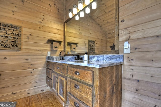 65 Weoka Ct, Ellijay, GA 30540 - bathroom featuring lofted ceiling, vanity, and wood walls