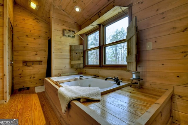 65 Weoka Ct, Ellijay, GA 30540 - bathroom featuring wooden walls, wooden ceiling, vaulted ceiling, a whirlpool tub, and wood finished floors