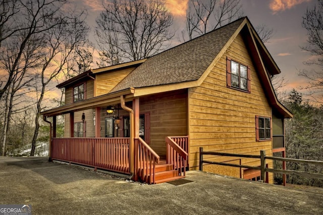 65 Weoka Ct, Ellijay, GA 30540 - view of front of property with a porch, a shingled roof, and fence