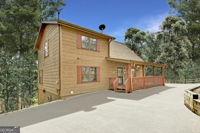 65 Weoka Ct, Ellijay, GA 30540 - view of front facade featuring a wooden deck, fence, and a shingled roof