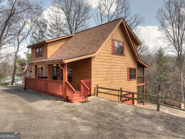 65 Weoka Ct, Ellijay, GA 30540 - view of front of property featuring a porch, fence, and roof with shingles