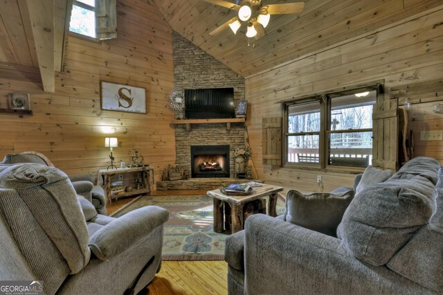 65 Weoka Ct, Ellijay, GA 30540 - living room featuring wood-type flooring, wood walls, high vaulted ceiling, a ceiling fan, and wood ceiling