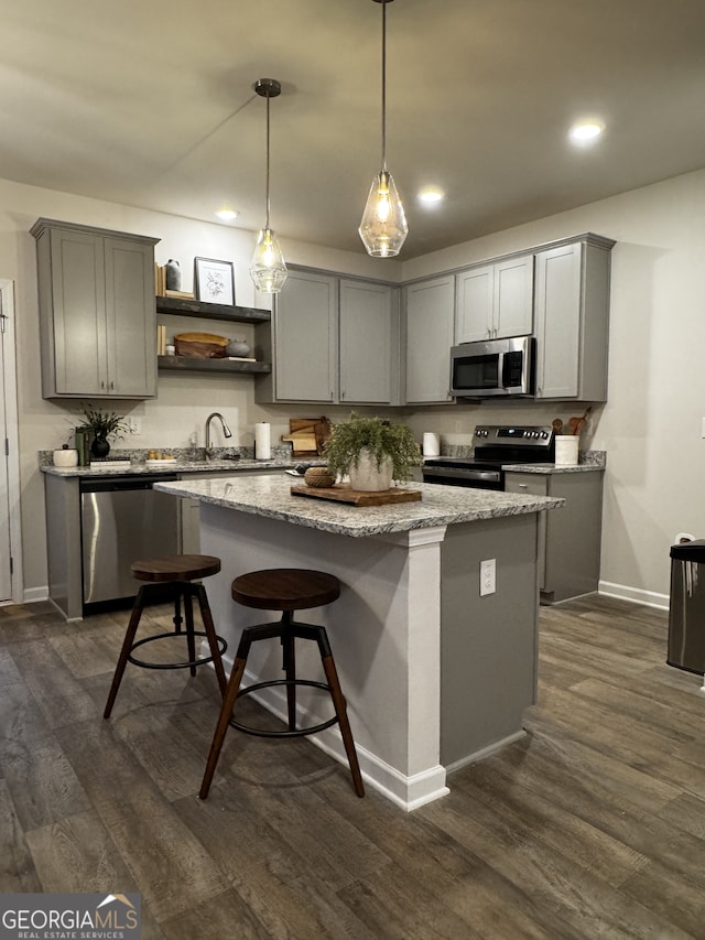 235 Ivey Ter Unit 40, Temple, GA 30179 - kitchen featuring gray cabinets, open shelves, a kitchen island, dark wood finished floors, and stainless steel appliances