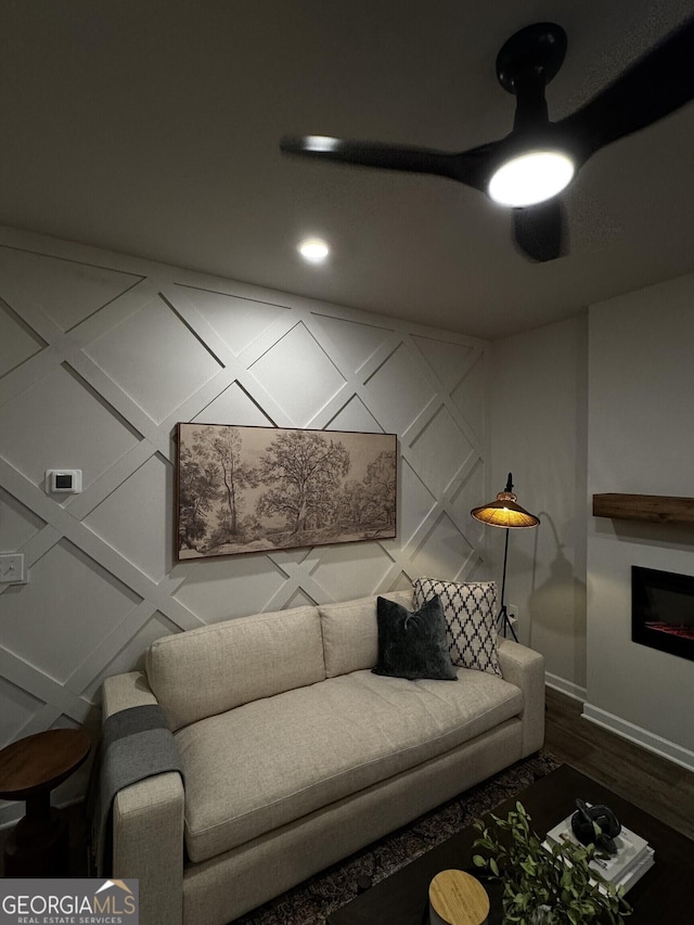 235 Ivey Ter Unit 40, Temple, GA 30179 - living area with a glass covered fireplace, baseboards, and wood finished floors