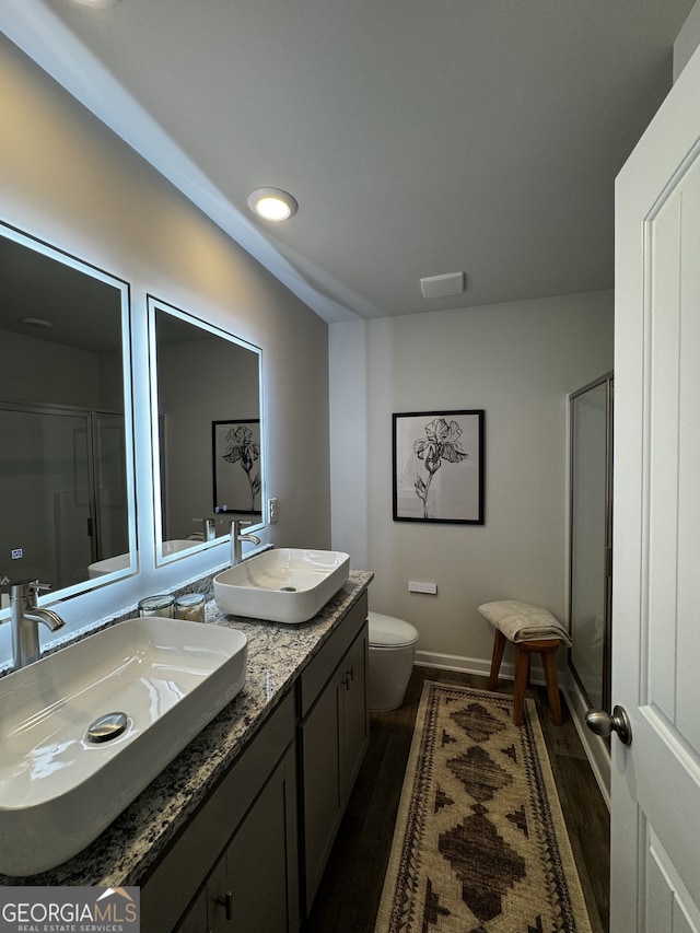 235 Ivey Ter Unit 40, Temple, GA 30179 - bathroom with toilet, a shower with shower door, and a sink