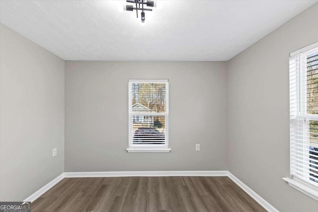 2478 Verbena Cir NW, Atlanta, GA 30314 - empty room featuring baseboards and dark wood-style flooring
