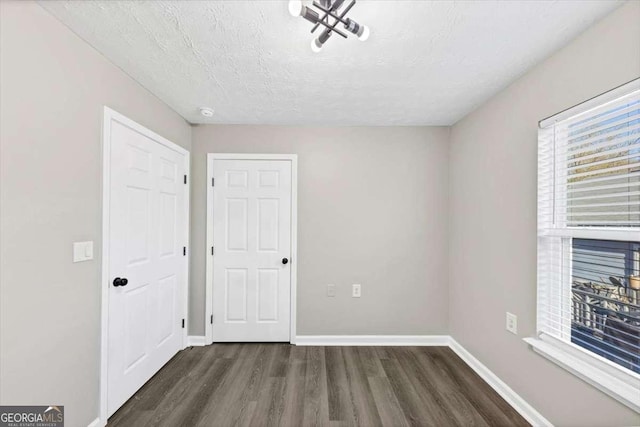 2478 Verbena Cir NW, Atlanta, GA 30314 - interior space featuring baseboards, a textured ceiling, and wood finished floors