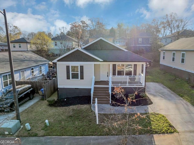 2478 Verbena Cir NW, Atlanta, GA 30314 - view of front of house featuring a front yard, roof with shingles, covered porch, crawl space, and a residential view