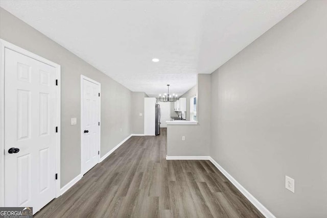 2478 Verbena Cir NW, Atlanta, GA 30314 - unfurnished dining area featuring a notable chandelier, baseboards, and dark wood-style flooring
