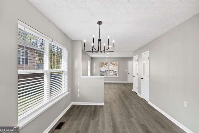 2478 Verbena Cir NW, Atlanta, GA 30314 - unfurnished dining area with visible vents, baseboards, a healthy amount of sunlight, and a chandelier