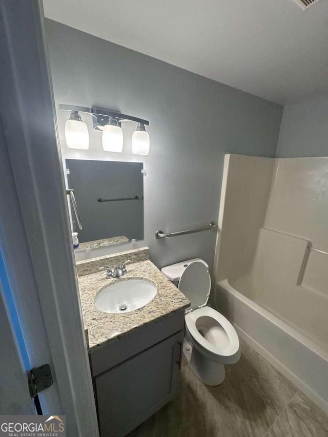 3426 Glenwood Rd, Decatur, GA 30032 - bathroom with toilet, vanity, and shower / tub combination