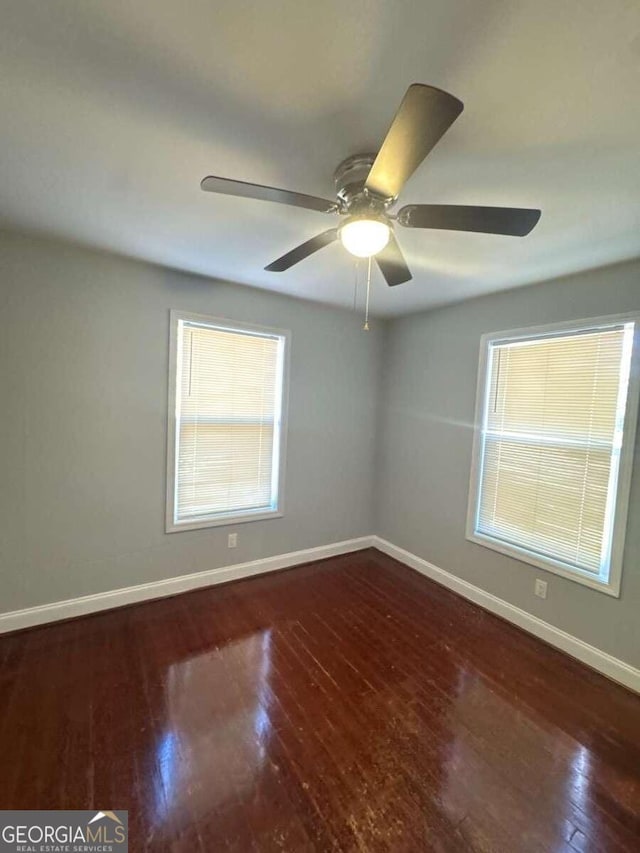 3426 Glenwood Rd, Decatur, GA 30032 - empty room with a ceiling fan, wood finished floors, and baseboards
