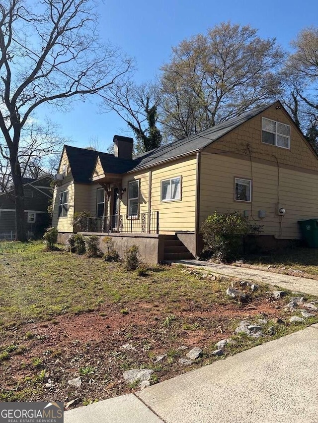 3426 Glenwood Rd, Decatur, GA 30032 - view of property exterior featuring a chimney