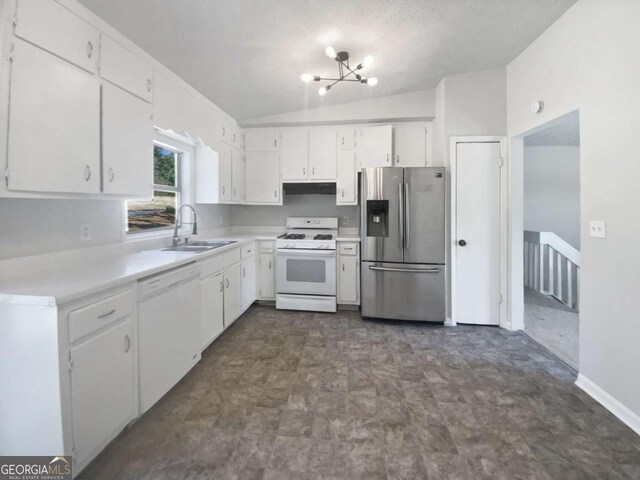 5216 Sweet Air Ln, Stone Mountain, GA 30088 - kitchen featuring white appliances, lofted ceiling, light countertops, white cabinets, and a chandelier
