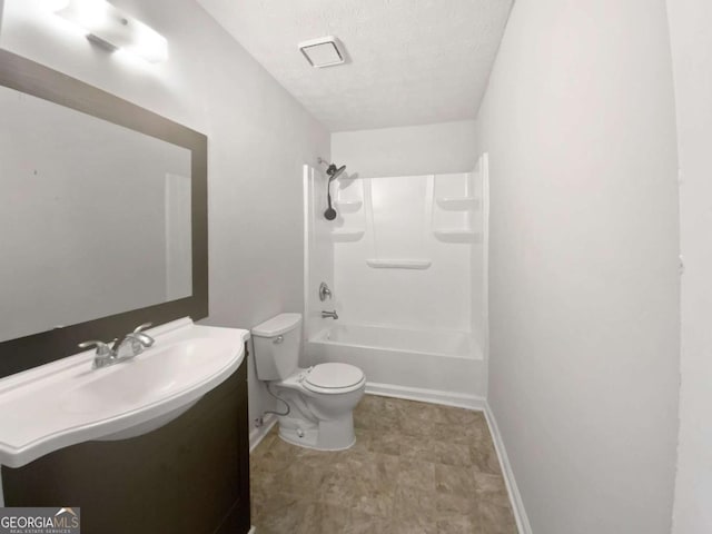 5216 Sweet Air Ln, Stone Mountain, GA 30088 - full bathroom featuring vanity, a textured ceiling, and tub / shower combination