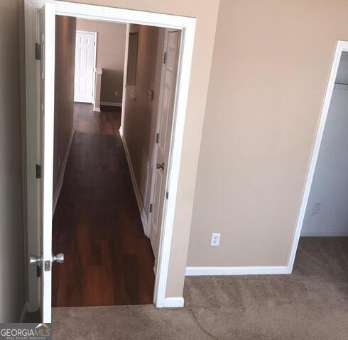 18102 Waldrop Cv, Decatur, GA 30034 - corridor with baseboards and carpet floors