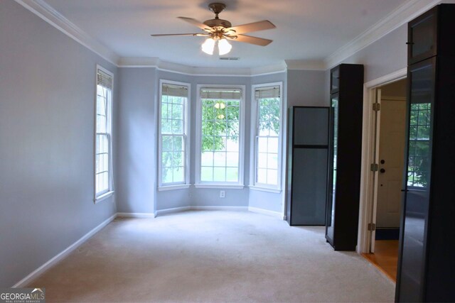 912 Tanners Point Dr, Lawrenceville, GA 30044 - kitchen featuring light countertops, light brown cabinets, a ceiling fan, and stainless steel appliances