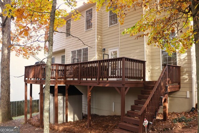912 Tanners Point Dr, Lawrenceville, GA 30044 - view of side of property with roof with shingles, driveway, an attached garage, brick siding, and fence