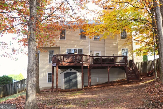 912 Tanners Point Dr, Lawrenceville, GA 30044 - view of property exterior with driveway, a yard, a garage, and fence
