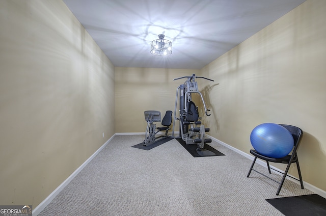 exercise area with carpet flooring and baseboards