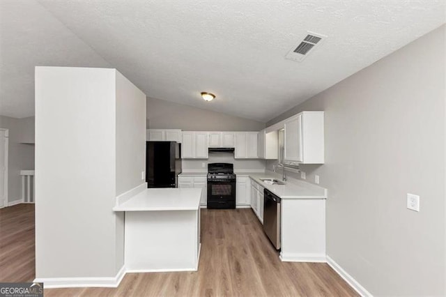 3671 Satellite Blvd, Ellenwood, GA 30294 - kitchen featuring a sink, white cabinetry, black appliances, and light countertops