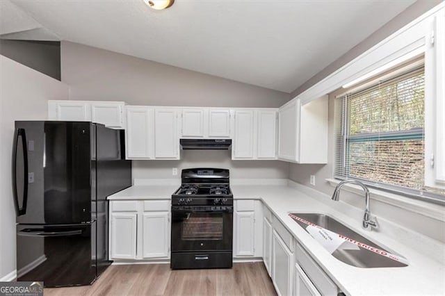 3671 Satellite Blvd, Ellenwood, GA 30294 - kitchen featuring a sink, black appliances, range hood, and white cabinets