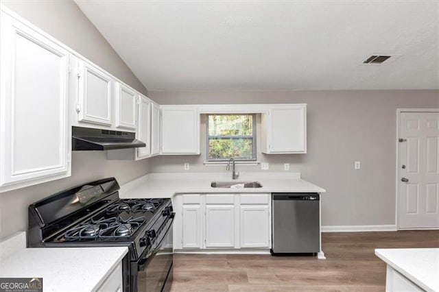 3671 Satellite Blvd, Ellenwood, GA 30294 - kitchen with visible vents, a sink, under cabinet range hood, stainless steel dishwasher, and black range with gas stovetop
