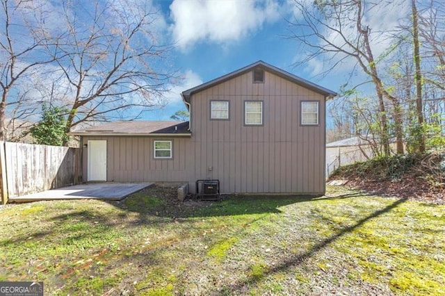 3671 Satellite Blvd, Ellenwood, GA 30294 - rear view of house featuring a patio area, central AC unit, fence, and a yard