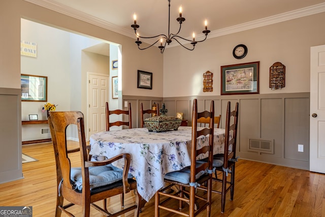 5 Pembroke Ln, Cartersville, GA 30120 - dining space featuring visible vents, a notable chandelier, ornamental molding, and a decorative wall