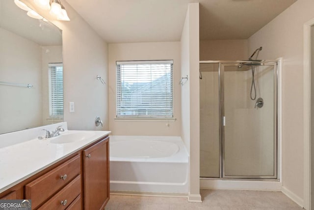 3879 Brockenhurst Dr, Buford, GA 30519 - bathroom featuring vanity, a shower stall, a garden tub, and tile patterned flooring