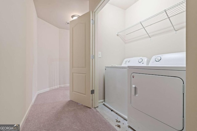 3879 Brockenhurst Dr, Buford, GA 30519 - washroom featuring washer and clothes dryer, laundry area, light carpet, and baseboards