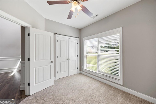 14 Carters Way, Forsyth, GA 31029 - unfurnished bedroom featuring baseboards, carpet flooring, a closet, and ceiling fan