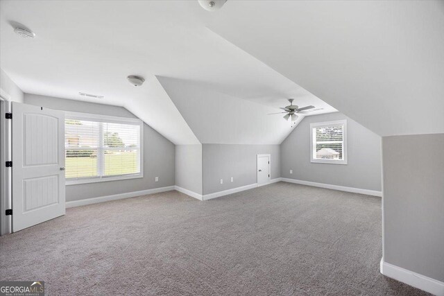 14 Carters Way, Forsyth, GA 31029 - bonus room featuring baseboards, carpet, healthy amount of natural light, and vaulted ceiling